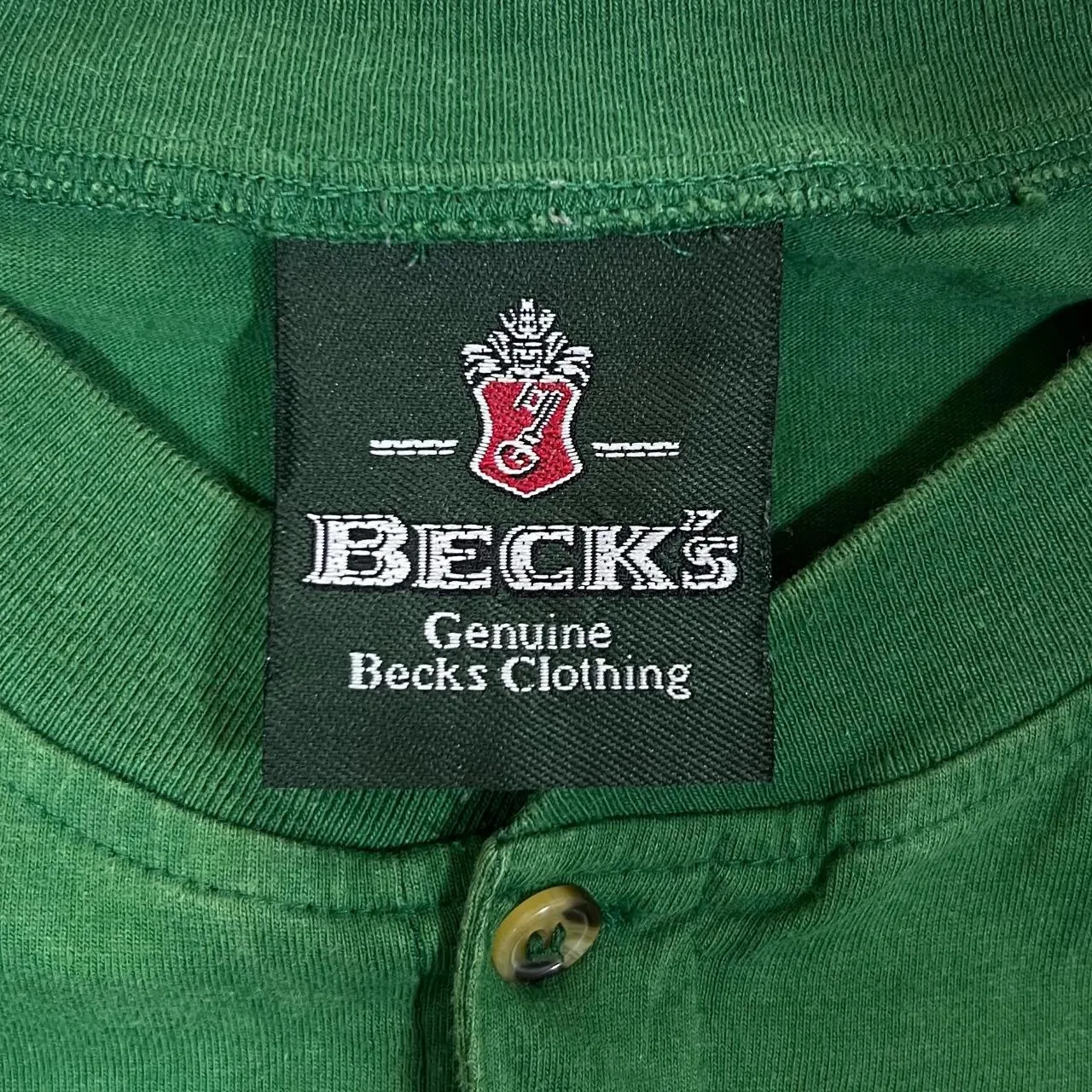 Vintage BECK'S Beer Promo Embroidered Mini Logo Faded Green Henley Button T-Shirt